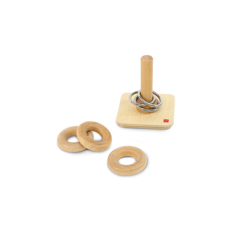 Wooden rings and metal rings on a vertical pin
