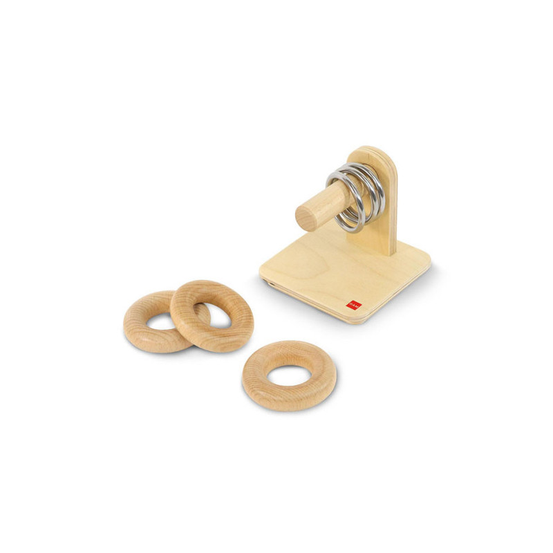 Wooden rings and metal rings on a horizontal pin